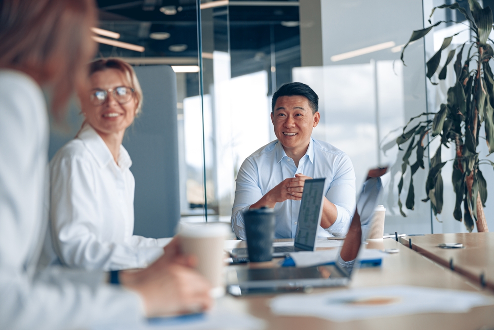 corporate professionals in a meeting to discuss Corporate 401K Planning