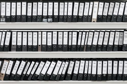 Shelves with binders of documents