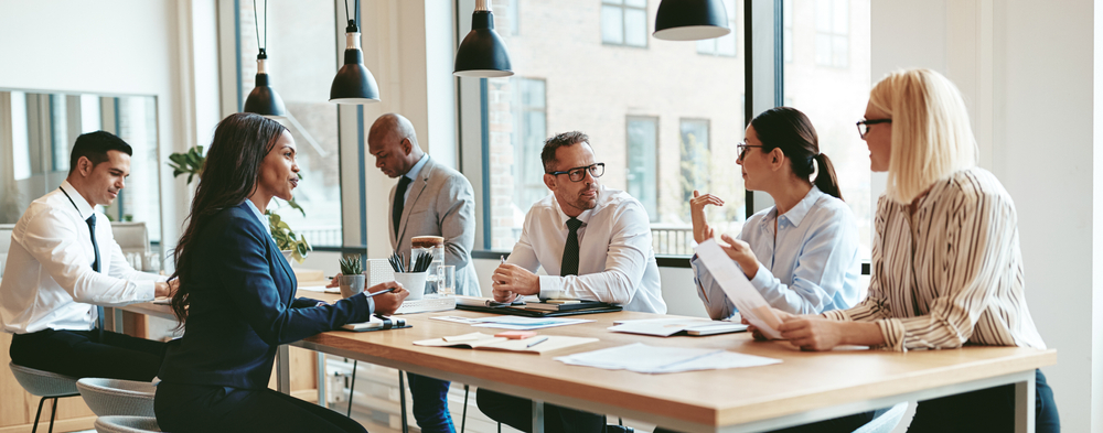 Professionals meeting to discuss internal accounting controls